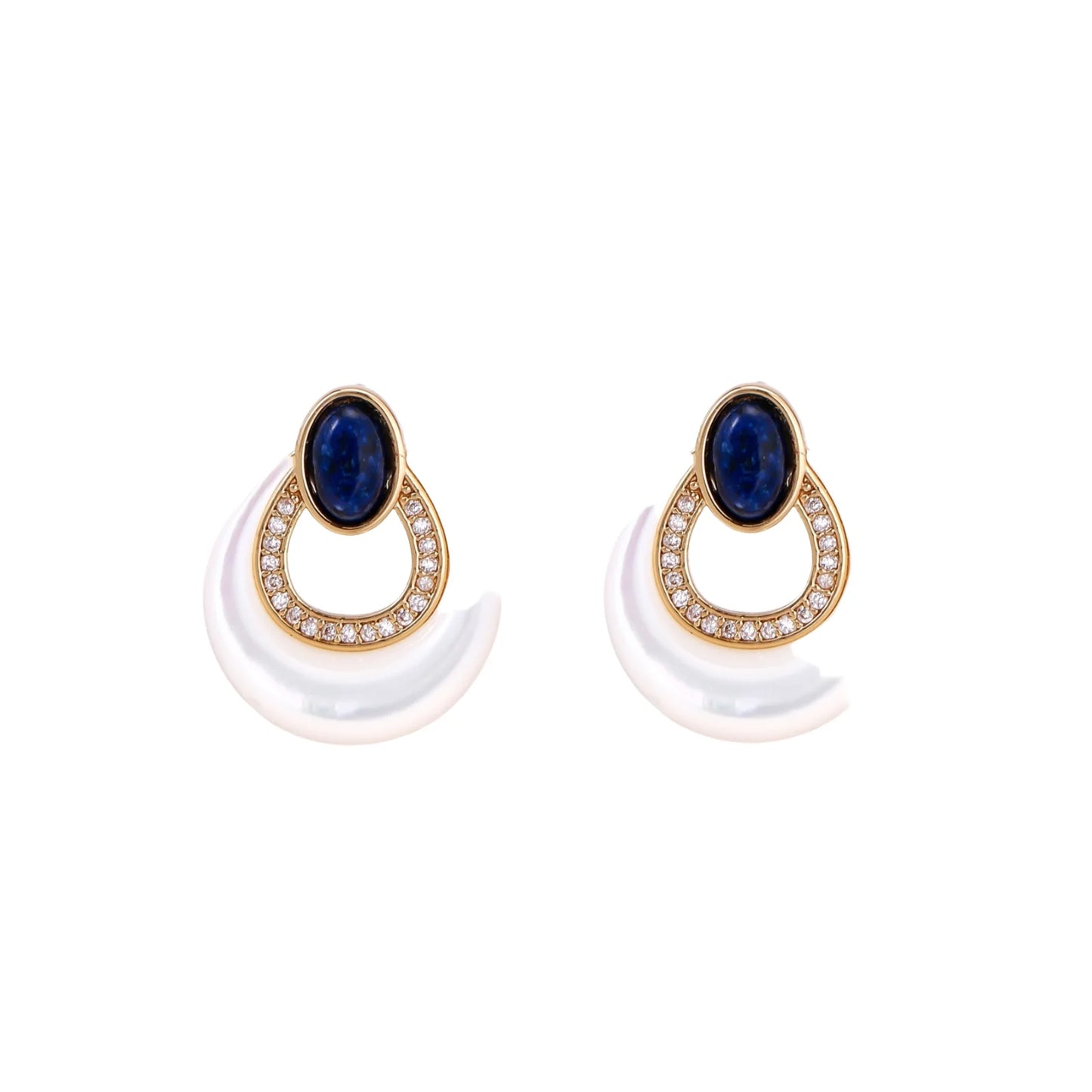 Gold drop earrings with oval lapis lazuli, crystal-paved frame, and iridescent mother-of-pearl teardrop on cream background