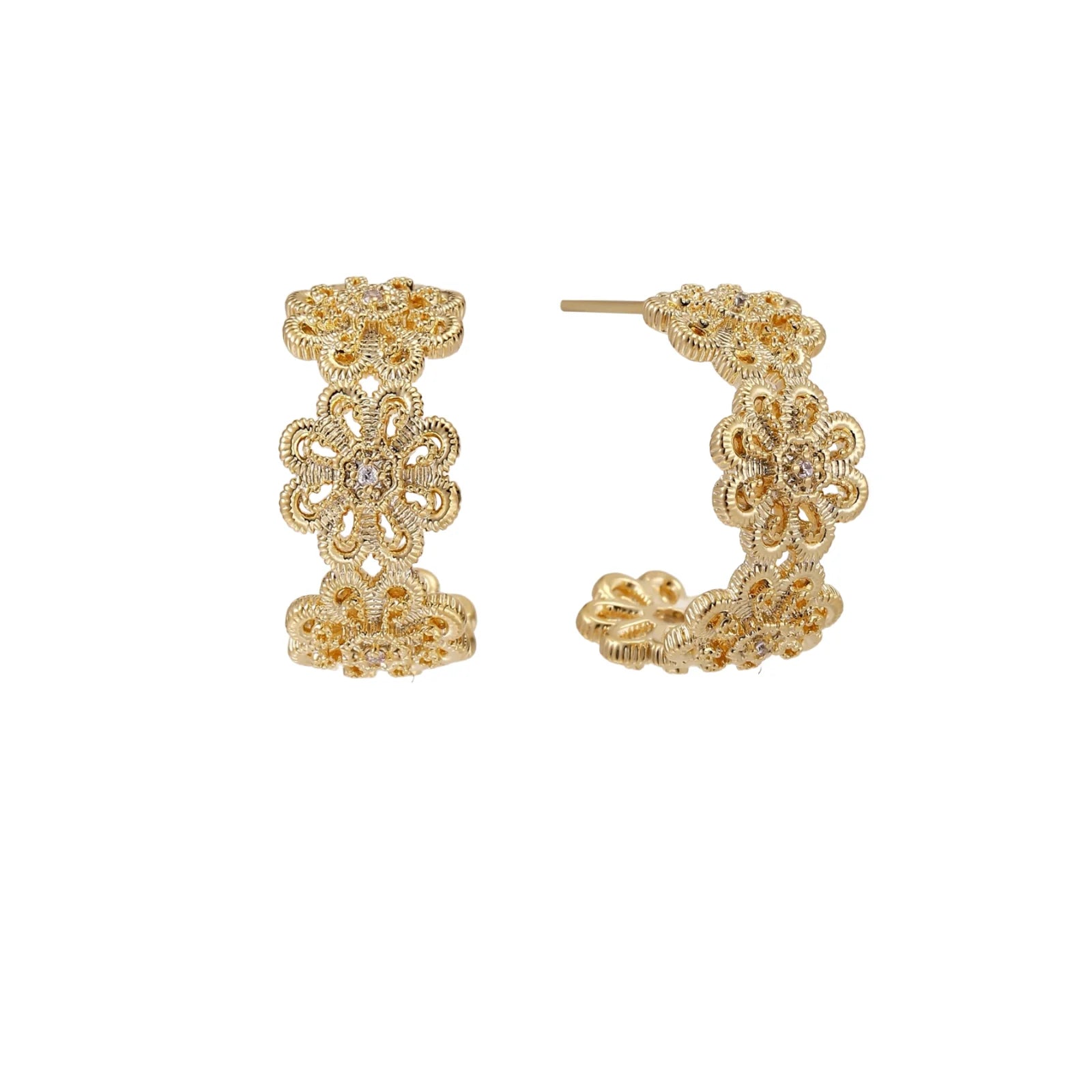 Gold hoop earrings with intricate three-dimensional floral filigree pattern in 14K gold plated brass on cream background