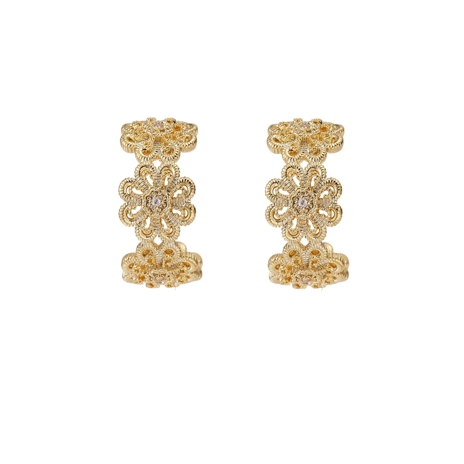 Gold hoop earrings with intricate three-dimensional floral filigree pattern in 14K gold plated brass on cream background