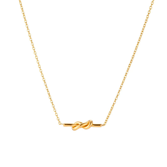 Dainty 18K gold plated necklace with infinity knot pendant on delicate chain against white background
