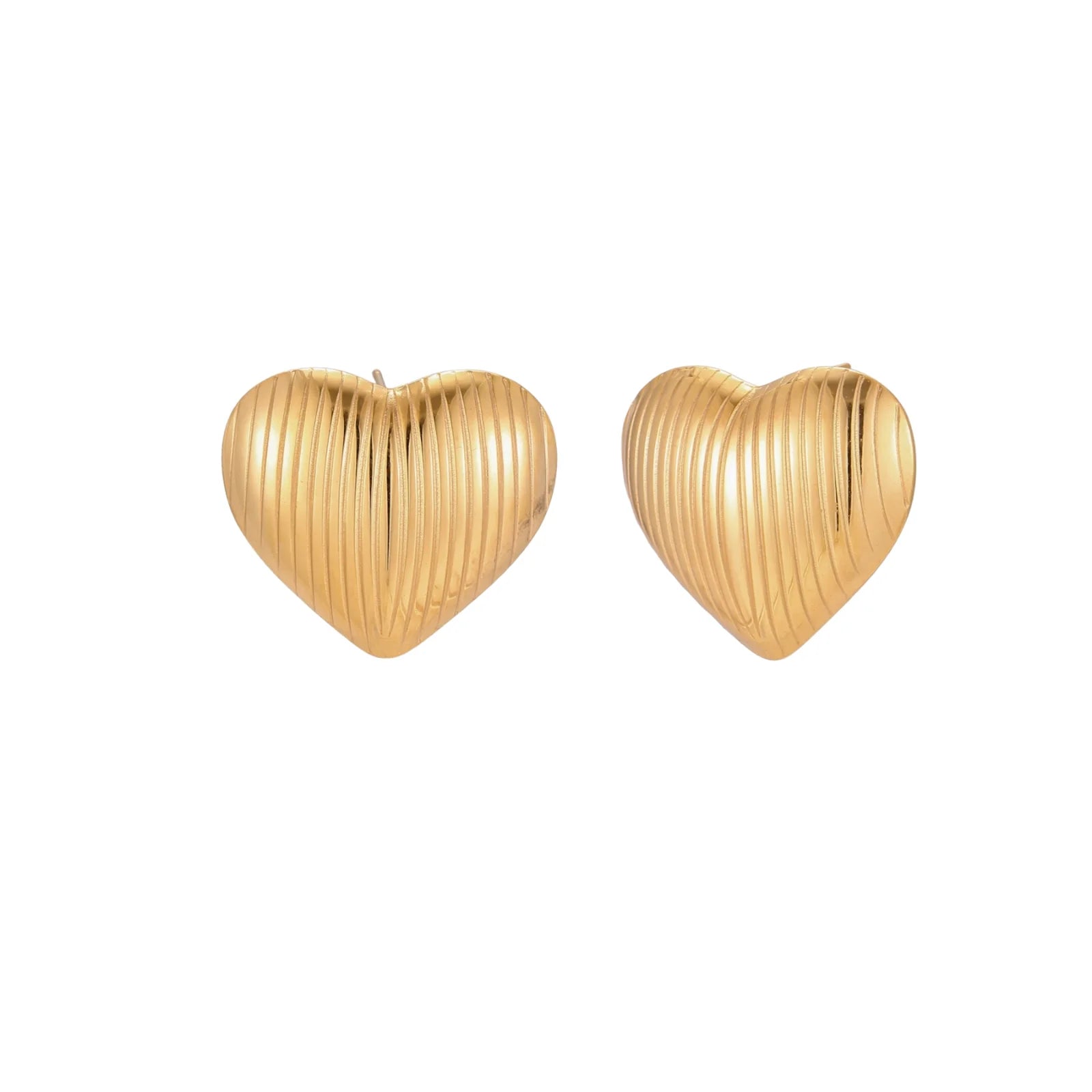 Gold heart-shaped stud earrings with parallel ridged texture on cream background