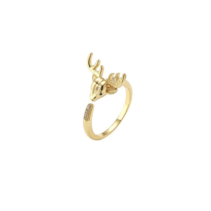 Gold-plated adjustable ring featuring 3D deer head with detailed antlers and cubic zirconia accents on cream background