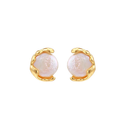 Gold vermeil studs with lustrous pink freshwater pearls in organic crescent settings