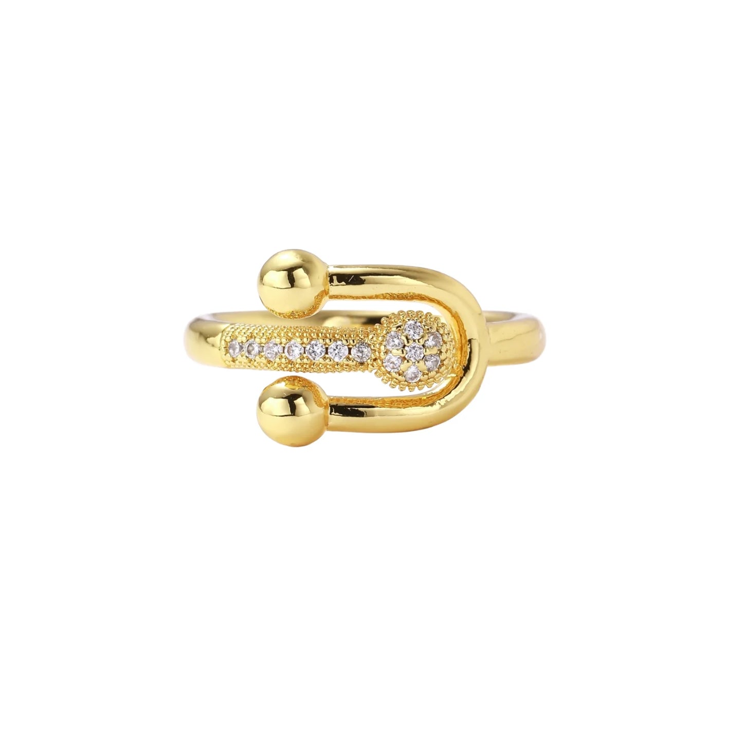 Gold-plated brass ring with safety pin design featuring pavé cubic zirconia stones and dual sphere ends