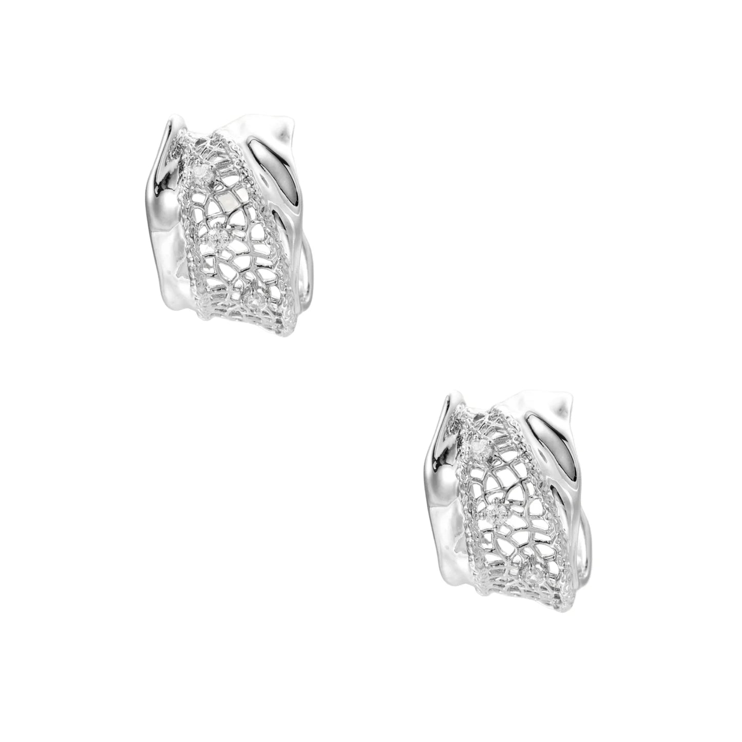 Close-up of sculptural hoop earrings with lattice center band and smooth twisted edges in white gold-plated brass with zirconia