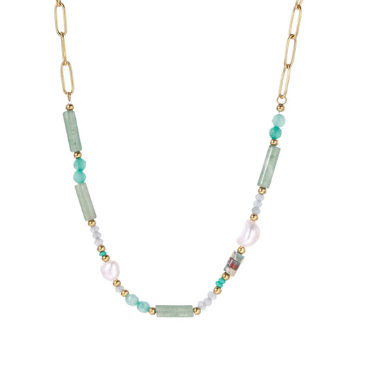 Gold chain necklace with seafoam green quartz cylinders, turquoise beads, and baroque pearl on cream background