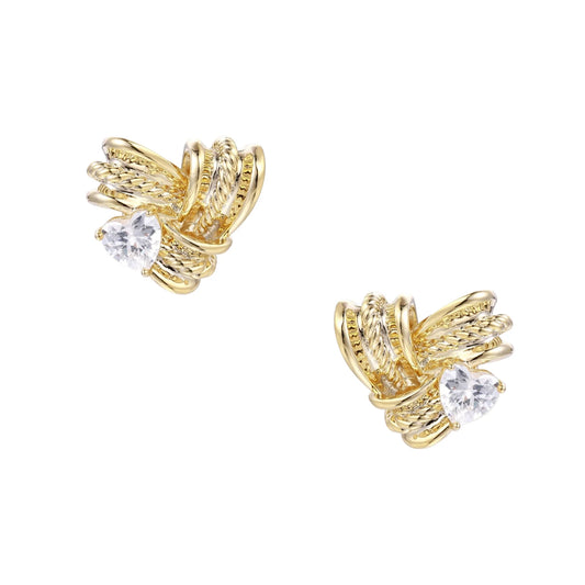 Pair of sculptural gold-plated wing stud earrings with zirconia stones on cream background, showing dimensional feather design