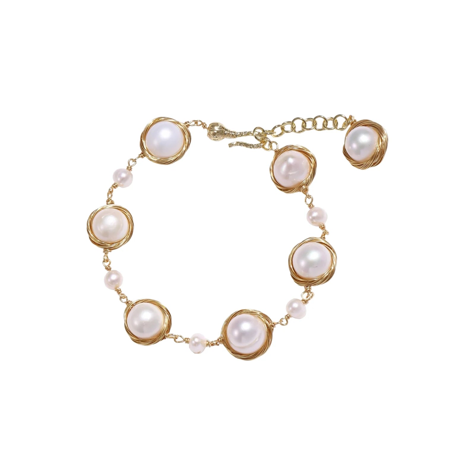 Gold wire-wrapped freshwater pearl bracelet with alternating pearl sizes on cream background, adjustable length