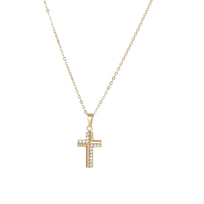 Delicate 14K gold-plated cross pendant with crystal accents on fine chain against cream background