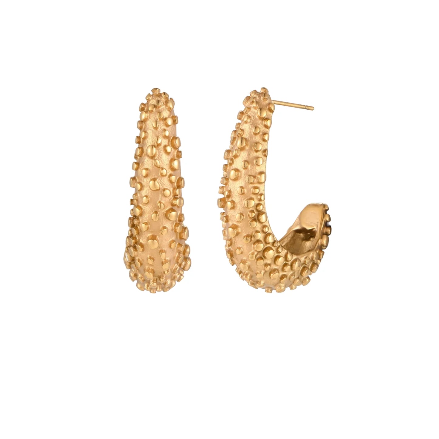 Curved gold hoop earrings with raised granulated texture resembling sea urchin surface on cream background