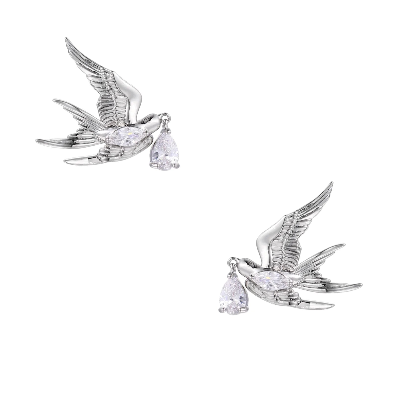 Silver-toned swallow stud earrings with detailed wings carrying teardrop zirconia crystals on white background