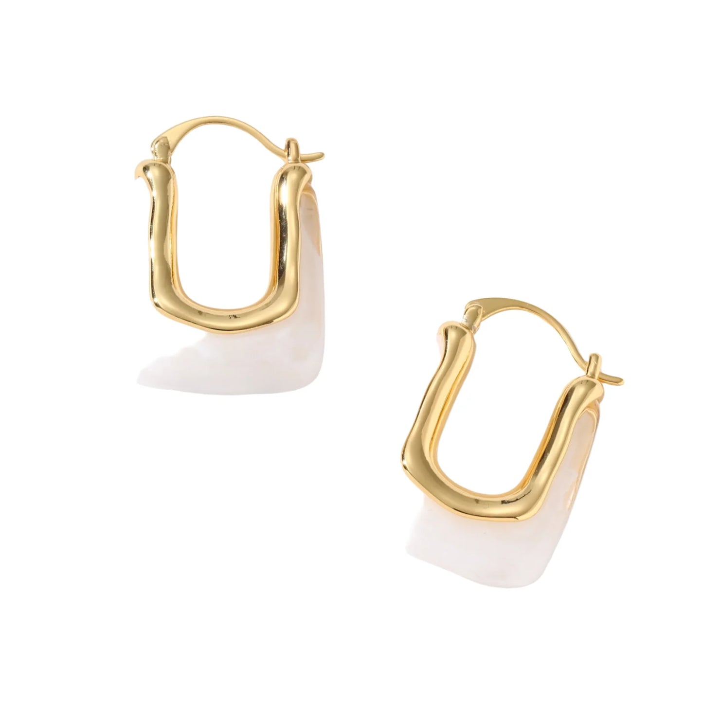 Sculptural gold-plated hoop earrings with flowing curved design and lever-back closure on cream background.