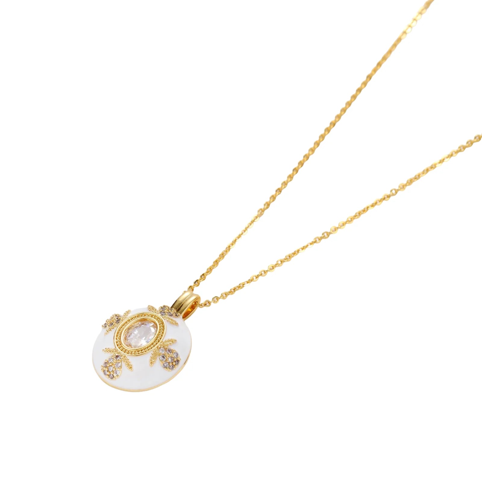 Gold-plated necklace with circular white enamel pendant featuring central zirconia stone and ornate decorative details