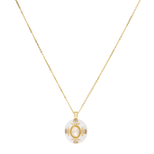 Gold-plated necklace with circular white enamel pendant featuring central zirconia stone and ornate decorative details